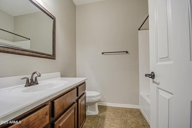 full bath with tile patterned flooring, vanity, toilet, and baseboards