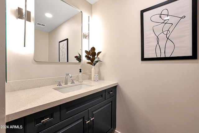 bathroom with visible vents and vanity