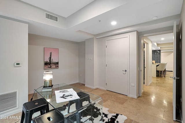 living room with recessed lighting, visible vents, and baseboards