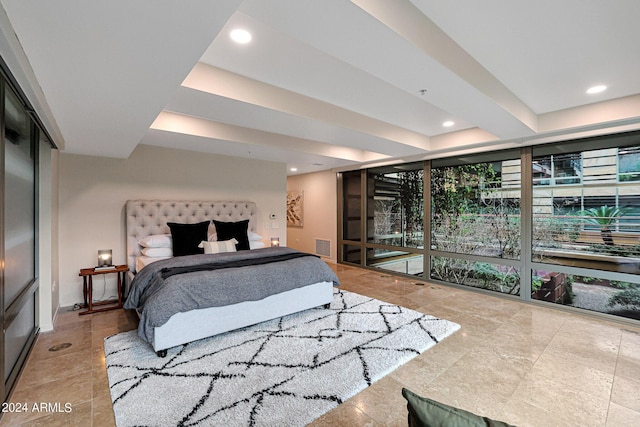 bedroom with recessed lighting, visible vents, a raised ceiling, and baseboards