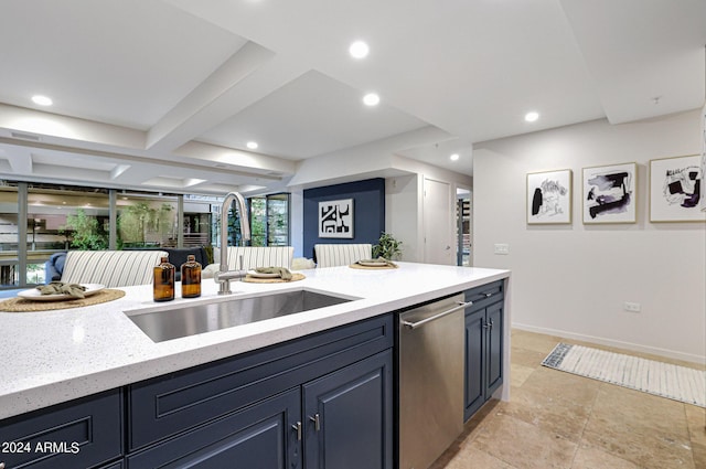 kitchen featuring stainless steel dishwasher, light stone counters, recessed lighting, and a sink