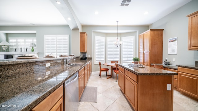 kitchen with visible vents, dishwasher, dark stone counters, recessed lighting, and a sink