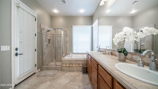 full bath featuring a sink, visible vents, and a stall shower