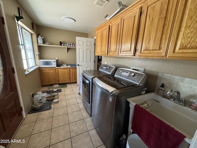 2404 W Palmer Dr, Payson, AZ 85541 - washroom with cabinet space, separate washer and dryer, light tile patterned flooring, and a textured ceiling