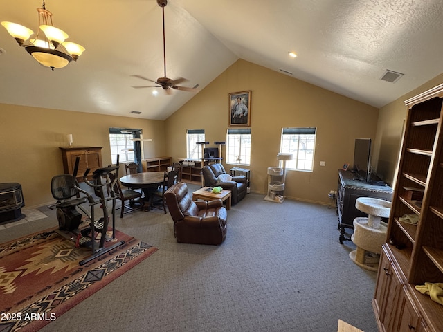 2404 W Palmer Dr, Payson, AZ 85541 - living area with lofted ceiling, ceiling fan, carpet flooring, and a wood stove