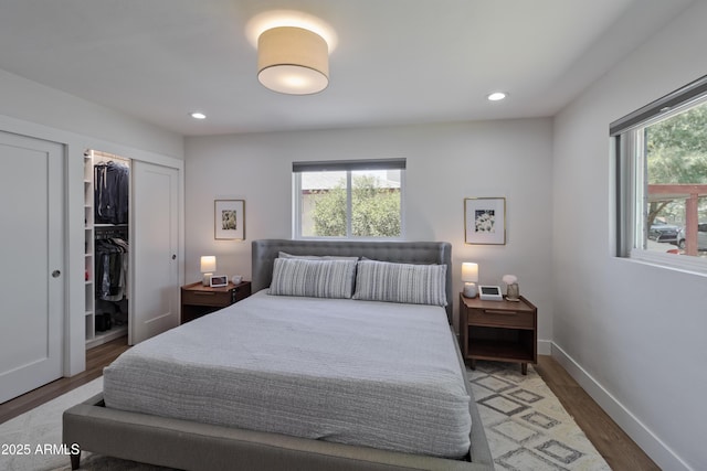 1839 E Palo Verde Dr, Phoenix, AZ 85016 - bedroom featuring multiple windows, wood finished floors, a closet, recessed lighting, and baseboards