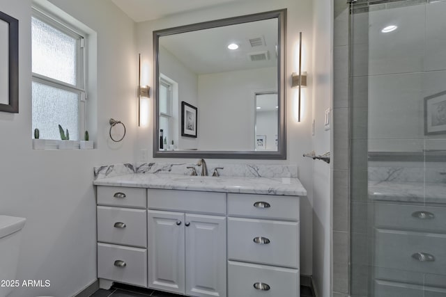 1839 E Palo Verde Dr, Phoenix, AZ 85016 - bathroom featuring vanity, toilet, a stall shower, and baseboards