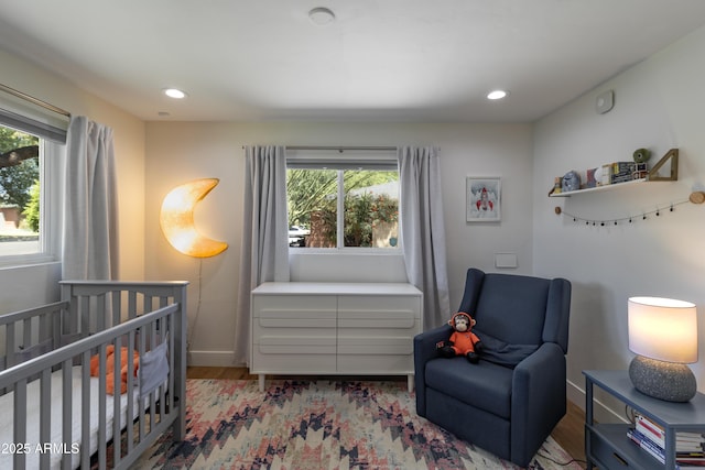 1839 E Palo Verde Dr, Phoenix, AZ 85016 - bedroom with wood finished floors, a nursery area, recessed lighting, and baseboards