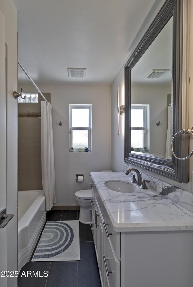 1839 E Palo Verde Dr, Phoenix, AZ 85016 - bathroom with vanity, toilet, tile patterned floors, and shower / bath combo with shower curtain