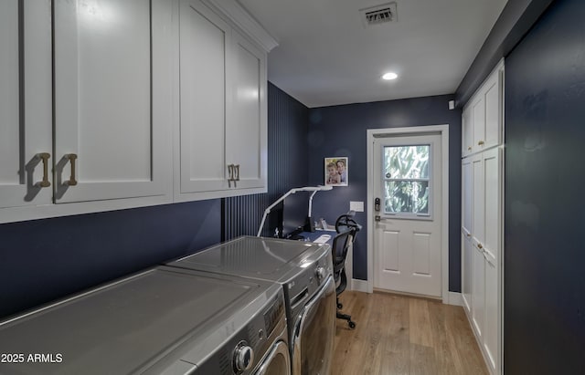 1839 E Palo Verde Dr, Phoenix, AZ 85016 - laundry area featuring washer and clothes dryer, cabinet space, light wood finished floors, recessed lighting, and baseboards