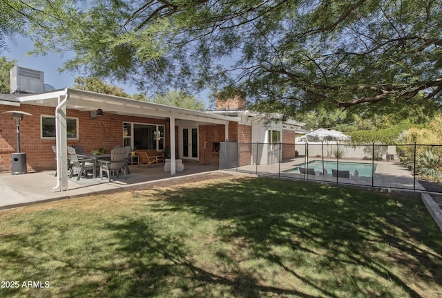 1839 E Palo Verde Dr, Phoenix, AZ 85016 - rear view of house featuring a chimney, brick siding, a patio area, and french doors