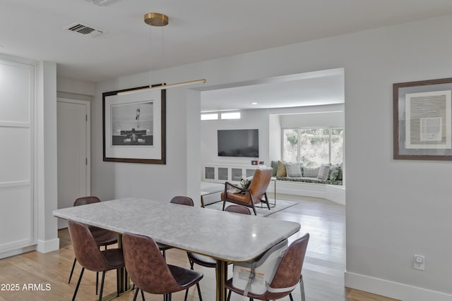 1839 E Palo Verde Dr, Phoenix, AZ 85016 - dining area with light wood-type flooring and baseboards