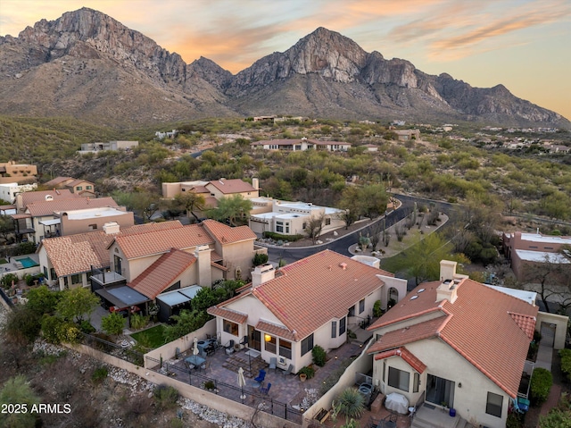 1705 E Deer Shadow Ln, Tucson, AZ 85737 - aerial view at dusk of a mountain view and a residential view