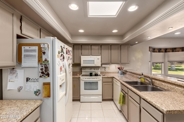 kitchen featuring a sink, light countertops, light tile patterned flooring, recessed lighting, and white appliances
