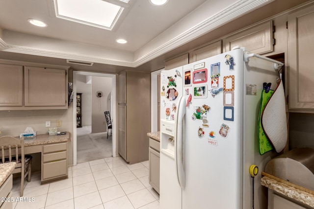 kitchen with recessed lighting, light tile patterned floors, white refrigerator with ice dispenser, visible vents, and built in study area