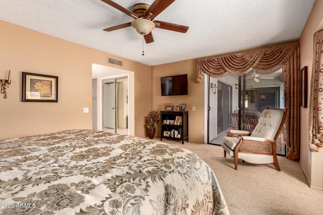 bedroom with access to outside, a ceiling fan, visible vents, light carpet, and a textured ceiling
