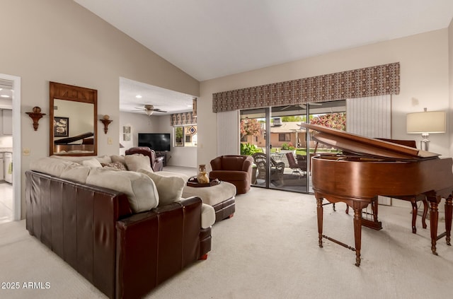 living room with ceiling fan, vaulted ceiling, and light carpet