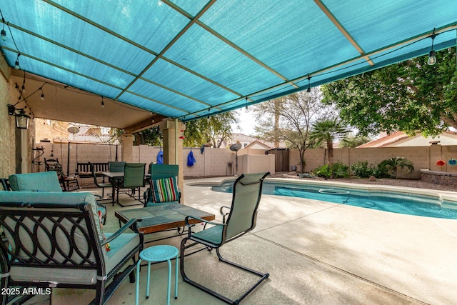 view of swimming pool featuring a patio area