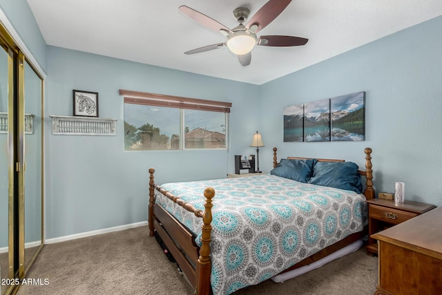 carpeted bedroom with ceiling fan and a closet