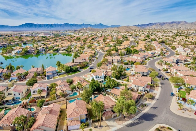 bird's eye view featuring a water and mountain view