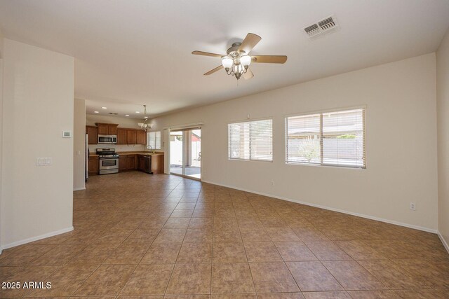 unfurnished living room with tile patterned flooring, recessed lighting, a ceiling fan, baseboards, and visible vents