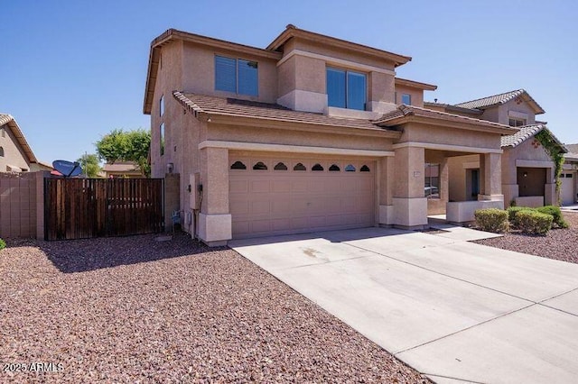 view of front of home featuring a tile roof, a garage, fence, concrete driveway, and stucco siding