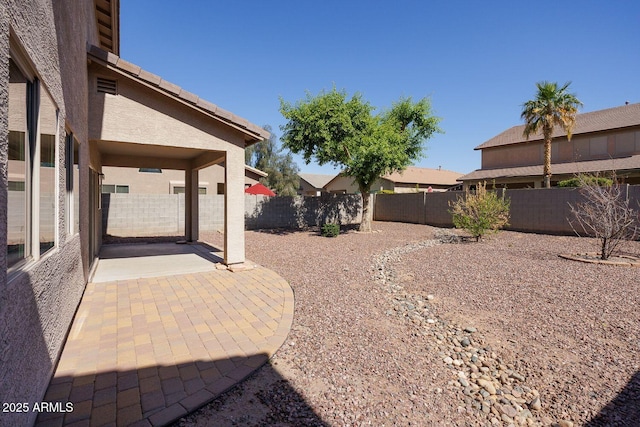 view of yard featuring a patio and a fenced backyard