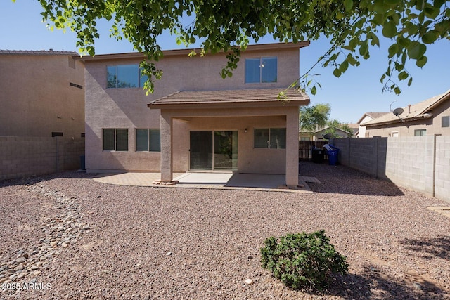 back of property featuring a patio, a fenced backyard, and stucco siding