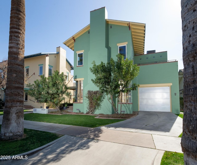 view of front facade with a garage and a front yard