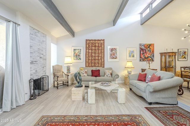 living room featuring a fireplace, lofted ceiling with beams, an inviting chandelier, and wood finished floors