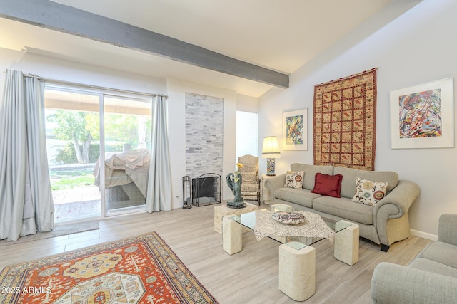 living room featuring vaulted ceiling with beams and wood finished floors