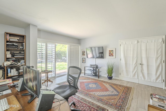 office featuring wood finished floors and baseboards