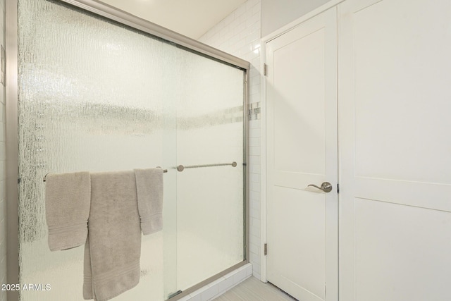 bathroom featuring a shower stall