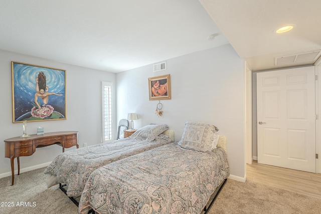 bedroom with visible vents, carpet floors, and baseboards