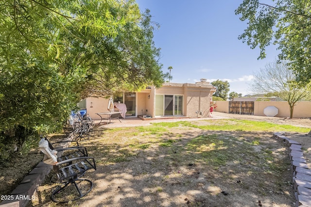 view of yard featuring a patio and fence