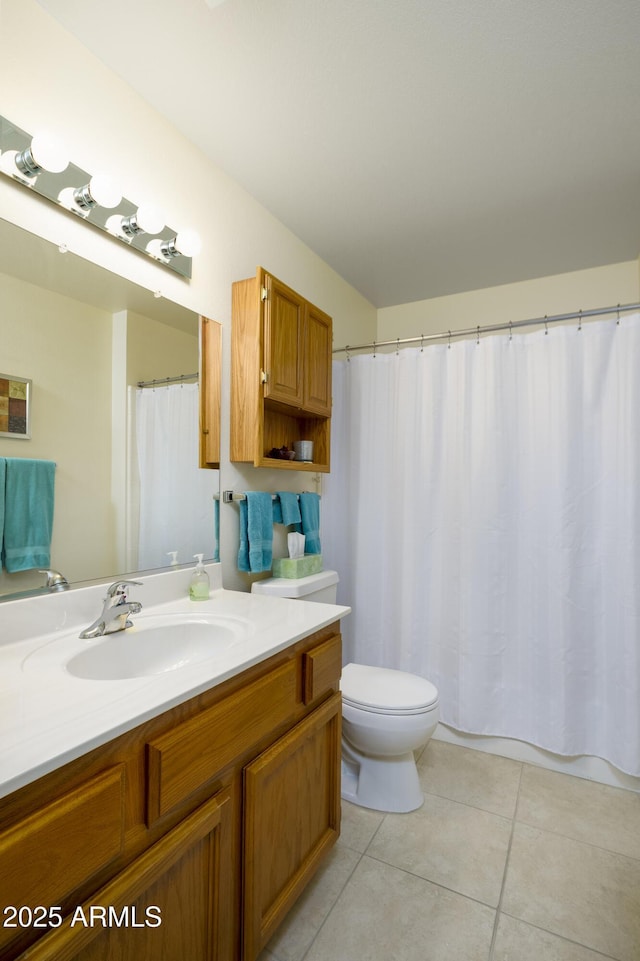 bathroom with tile patterned flooring, vanity, a shower with shower curtain, and toilet