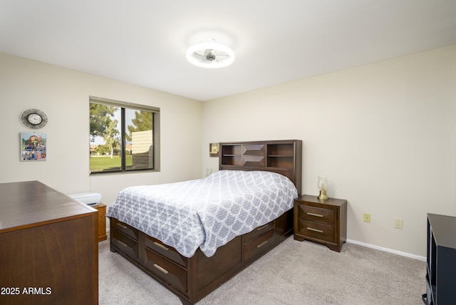 bedroom with light colored carpet