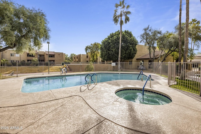 view of swimming pool featuring a community hot tub