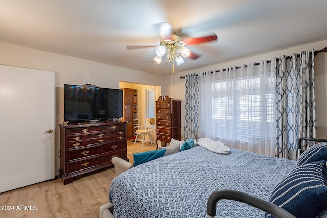 bedroom featuring light hardwood / wood-style flooring and ceiling fan