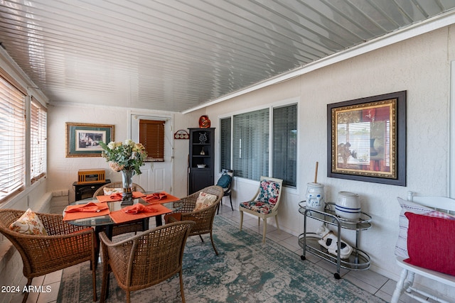 tiled dining area with crown molding