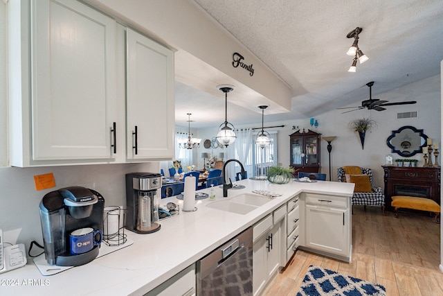 kitchen with sink, stainless steel dishwasher, light hardwood / wood-style floors, a textured ceiling, and white cabinets