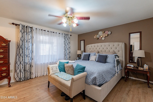 bedroom featuring ceiling fan and light wood-type flooring