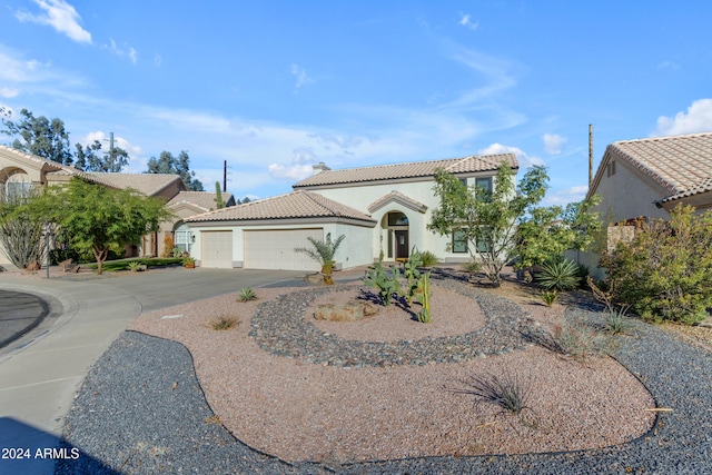 mediterranean / spanish-style house featuring a garage