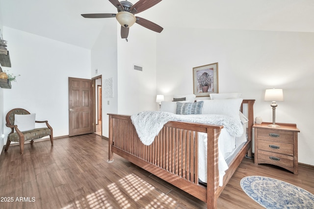 bedroom with hardwood / wood-style flooring, high vaulted ceiling, and ceiling fan