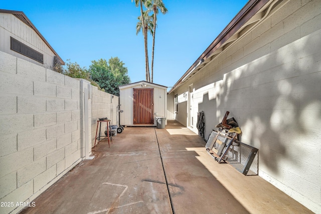 view of patio / terrace featuring a shed