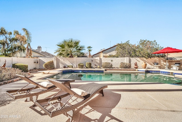 view of swimming pool featuring a patio area