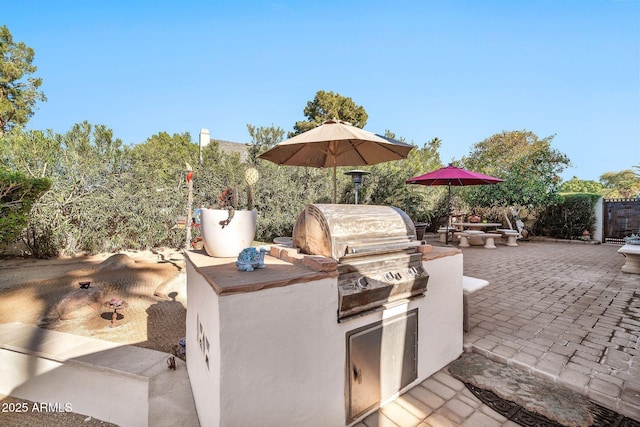 view of patio with exterior kitchen and area for grilling