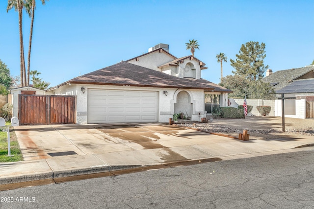 view of property with cooling unit and a garage