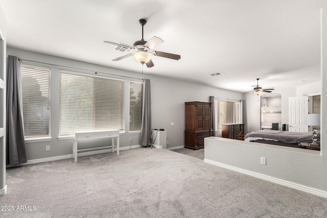 carpeted bedroom with baseboards and a ceiling fan