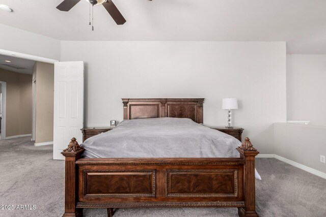 bedroom with light carpet, baseboards, and a ceiling fan